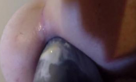 She inserts huge anal dildoes