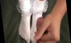 A footjob and frilly socks in white