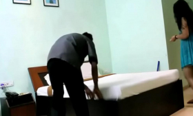 In blue lingerie, an Indian woman teases a room service boy