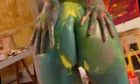 A hot chick plays with paint