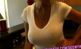 An open kitchen scene shows a big tits blonde wife masturbating