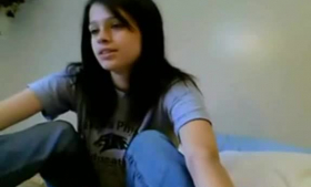 Slutty dark haired teen poses on bed