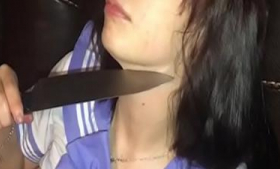 Teenage girl fucks herself using a knife