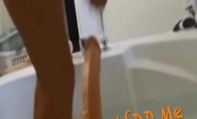 An Afro-tipped Milf plays with a Dildo in the shower - MilfddMe