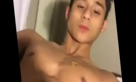 Two handsome Asian men jerk off each other