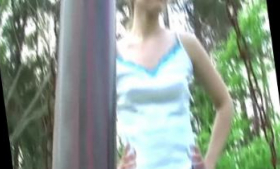 In the park, a teen flashes her body and plays with her friends