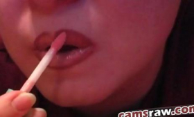 In a close-up, Jamie Lynn puts lipstick on her lips