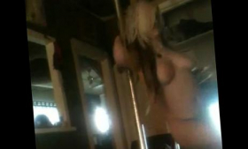 Pole dance by a naked woman