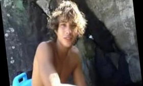 Dude in Brazilian surfboard jerks off