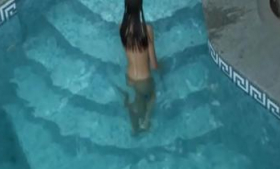 Swimming pool nude brunette