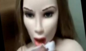 Her head is given to her by a love doll open mouth and stroke